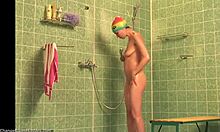 Colorful teen with long legs showering naked (voyeur video)